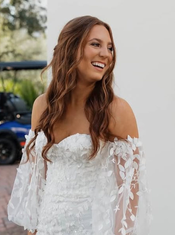 Bride with soft blonde updo and glam makeup