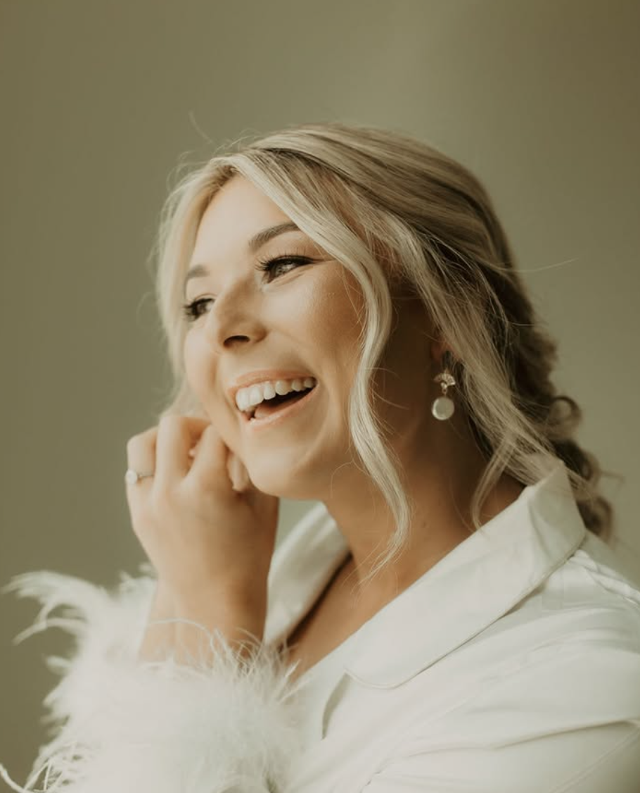 Bridal glam makeup with soft updo and gold eye